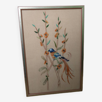 Tableau brodé oiseau bleu et orange