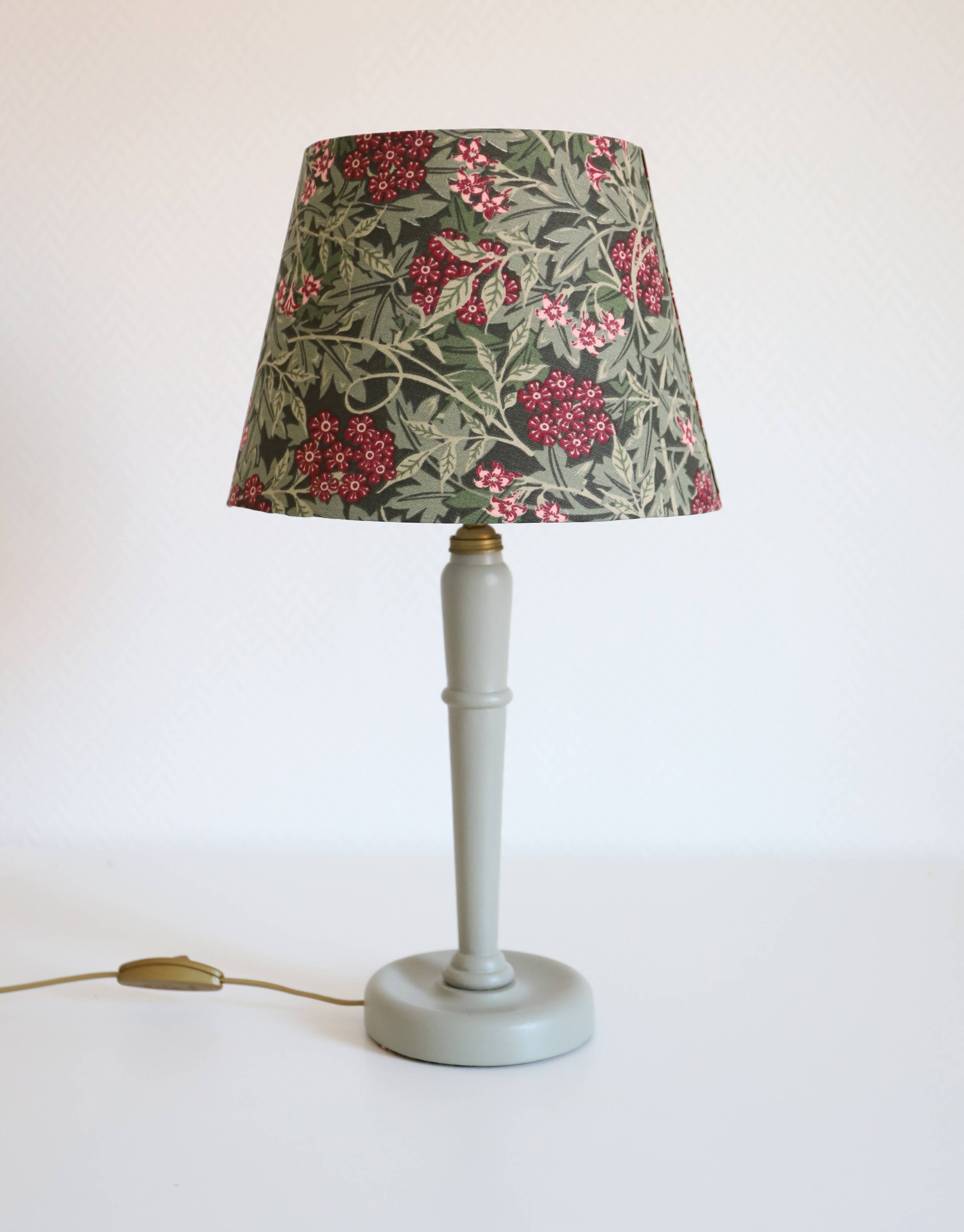 Table lamp, turned wooden base and antique printed lampshade