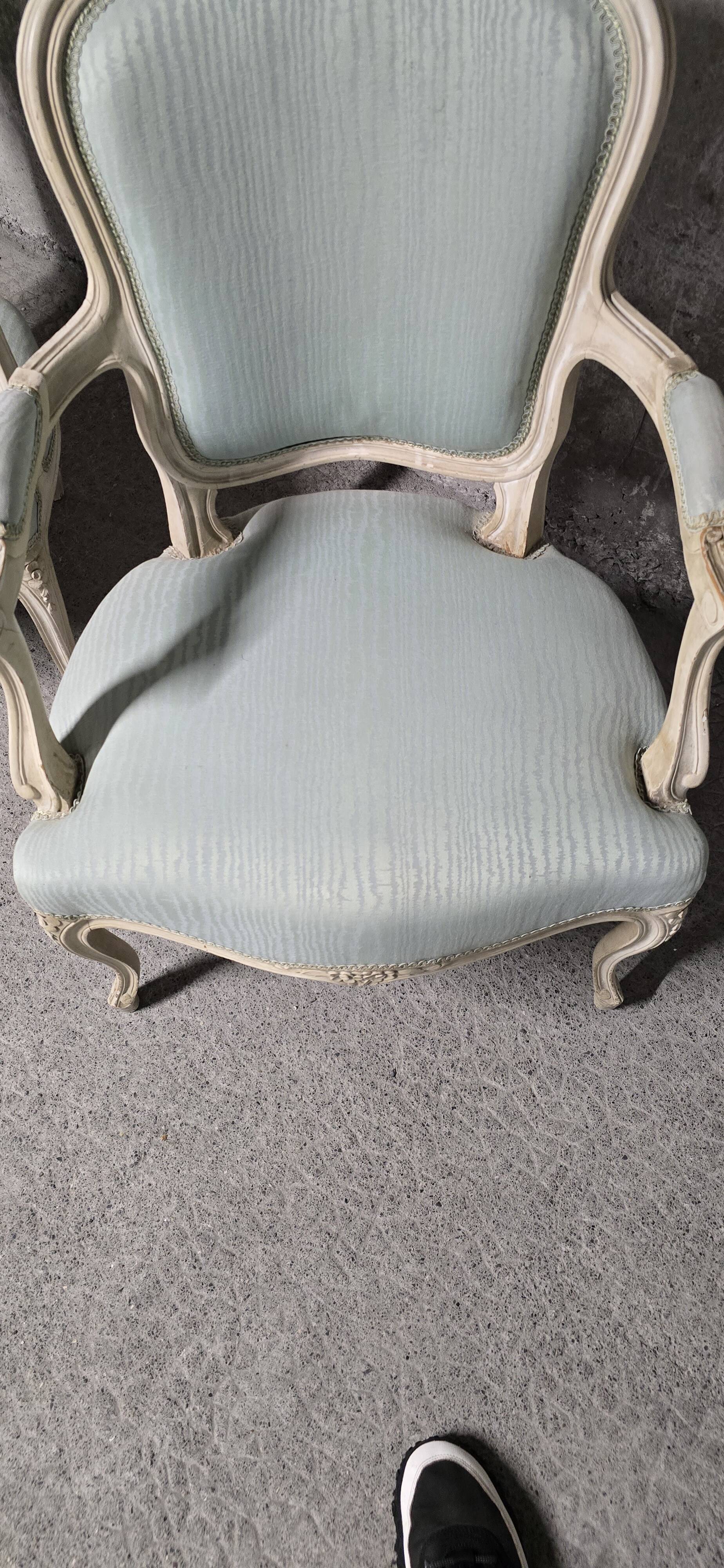 Pair of Louis XV style armchairs in patinated wood, light blue fabric.