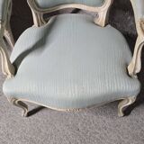 Pair of Louis XV style armchairs in patinated wood, light blue fabric.