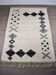 Tapis traditionnel en laine blanche fait à la main