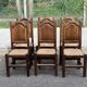 6 dining chairs in a country or farmhouse style, made of dark solid wood and rush-seated.