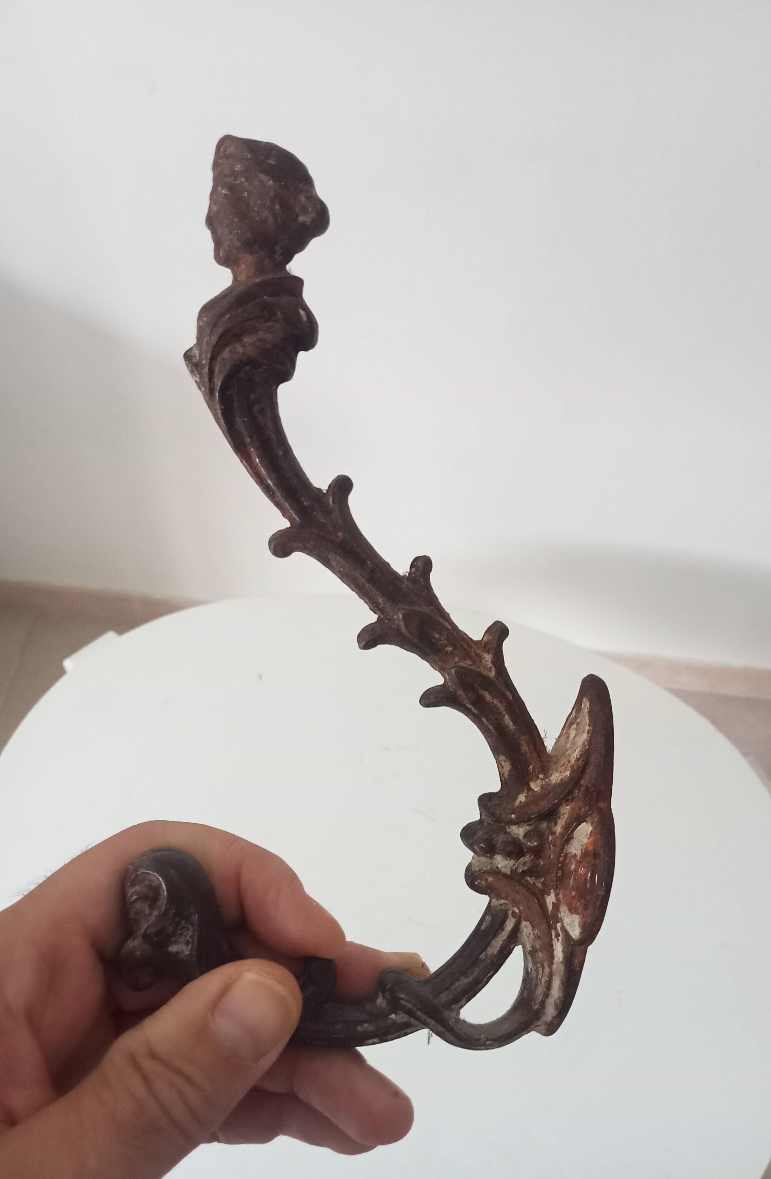 Antique wall coat hook from the 19th century in Victorian cast iron style.