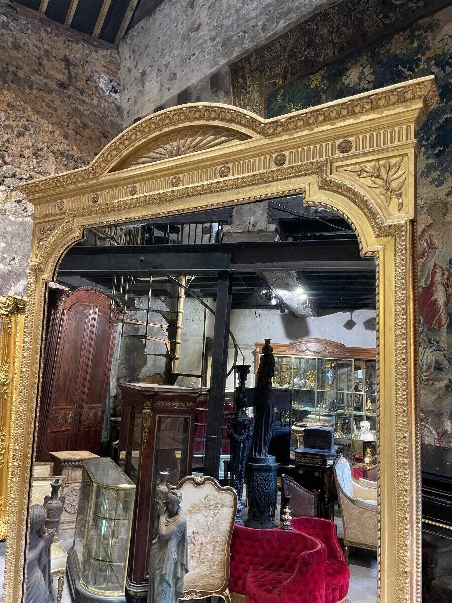 Louis XVI style gilded wood mirror from the Napoleonic III era, 2.75m x 1.48m.