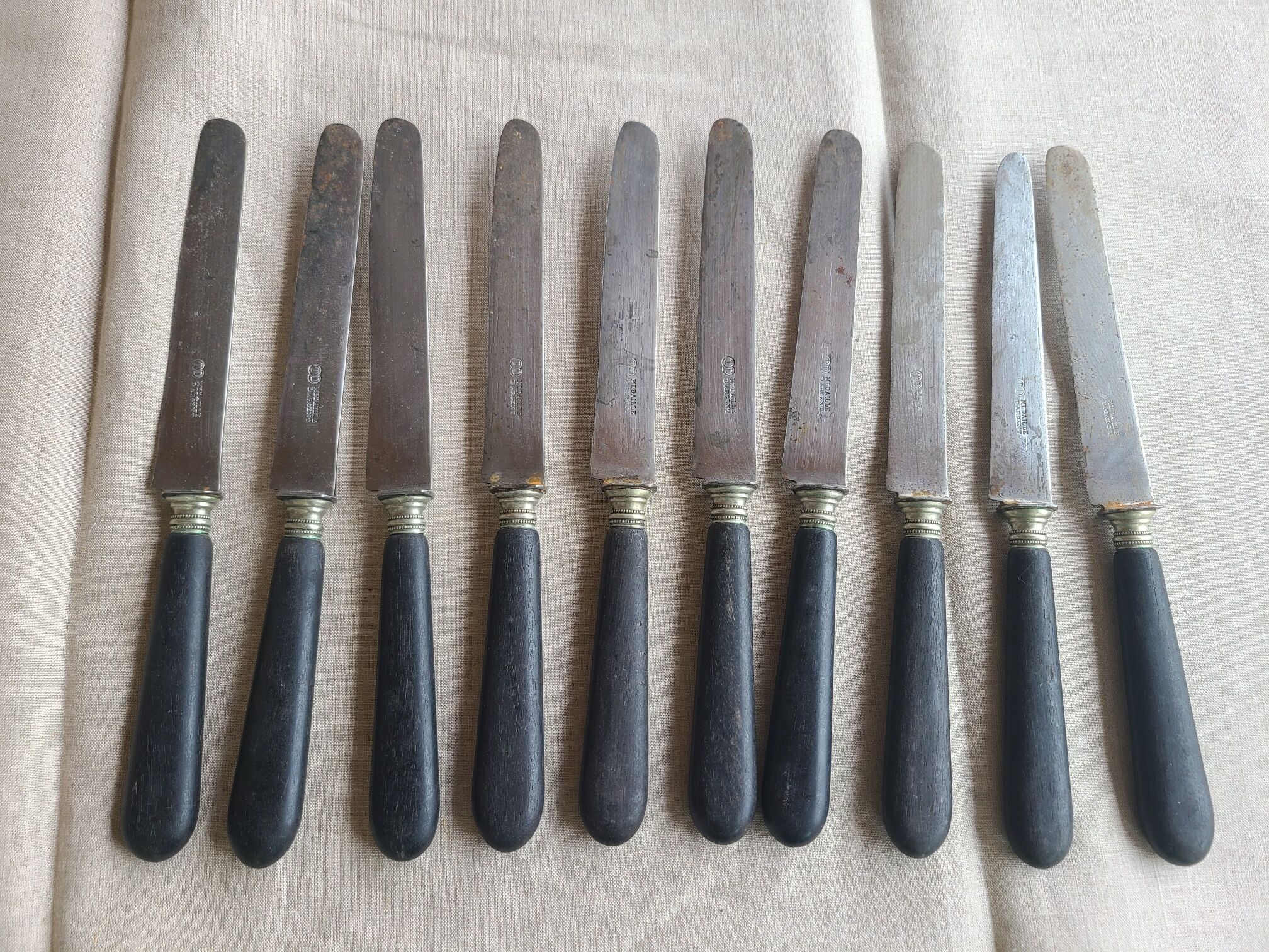 Antique knives blackened wooden handle