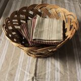 Vintage round wicker basket on stand