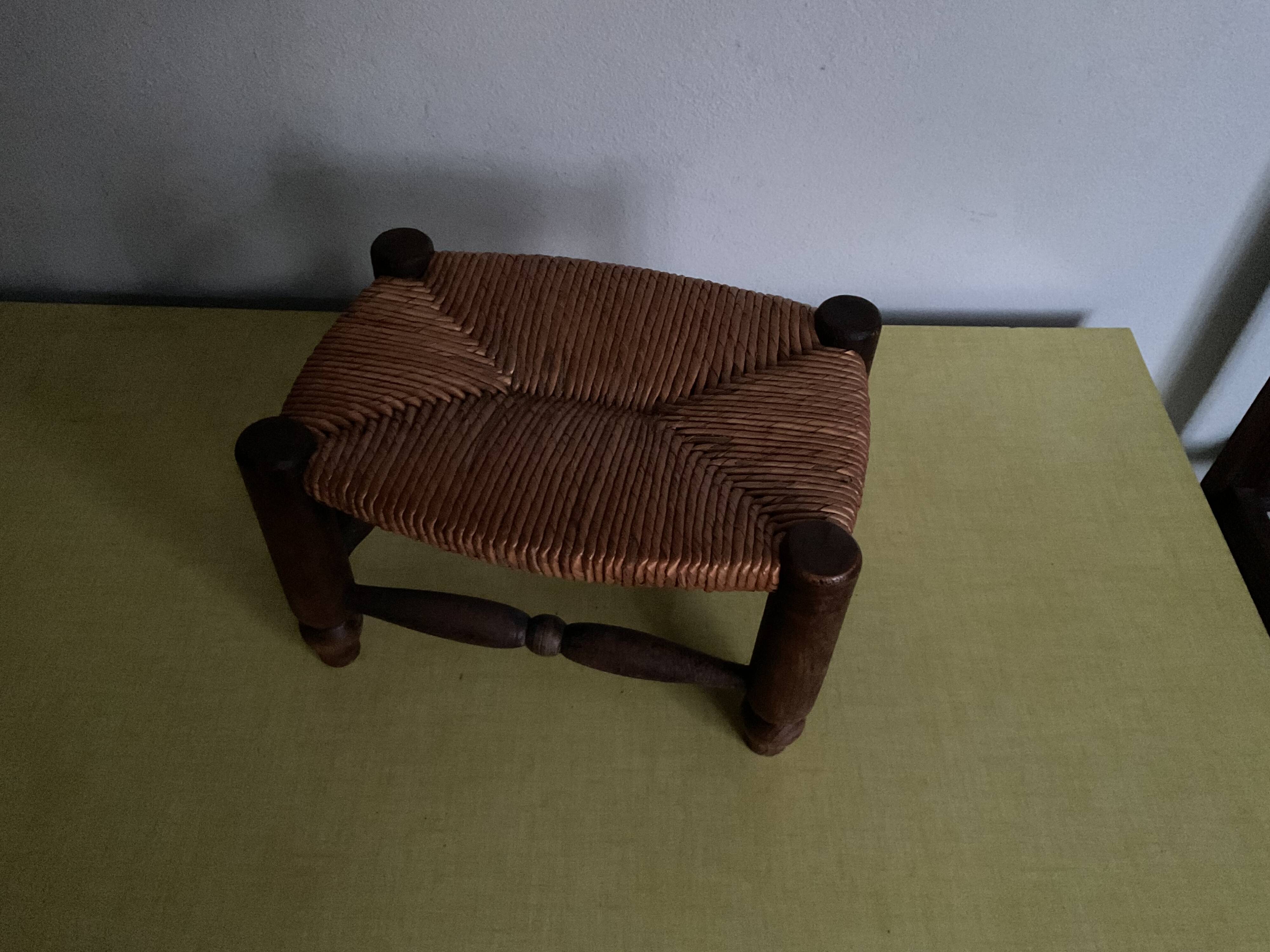 Turned wooden stool and straw