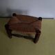 Turned wooden stool and straw