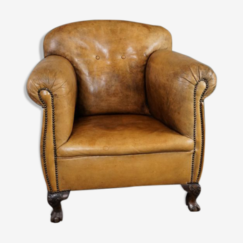 Fauteuil ancien en cuir de mouton