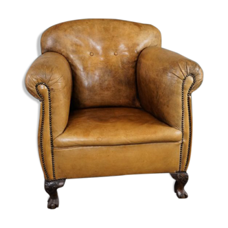 Fauteuil ancien en cuir de mouton