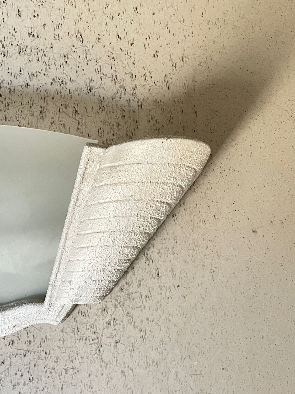 "Arlus" wall light in Art Deco style made of plaster and smoked glass.