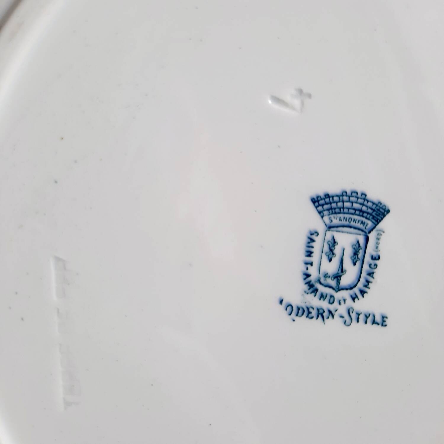 Old mismatched iron earthenware dessert plates accompanied by a dish