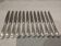 12 silver-plated dessert knives by Christofle Vendôme, 19.7cm