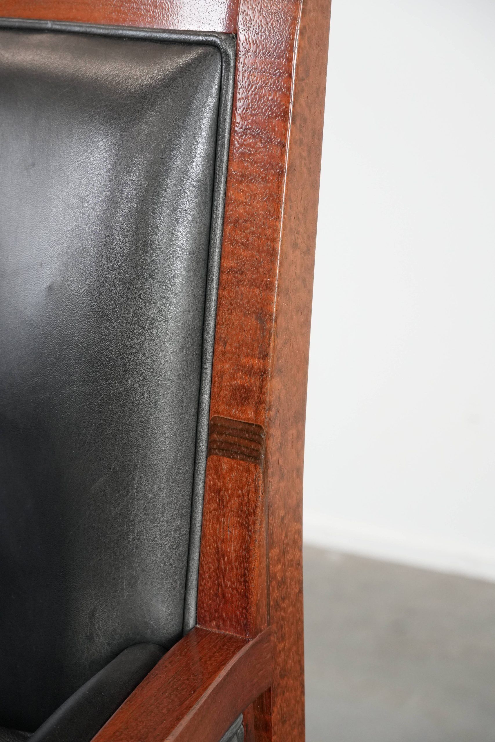 Black Art Deco cowhide leather and wooden design armchair with a high back