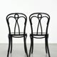 Set of 2 black vintage bistro chairs with an elegant design