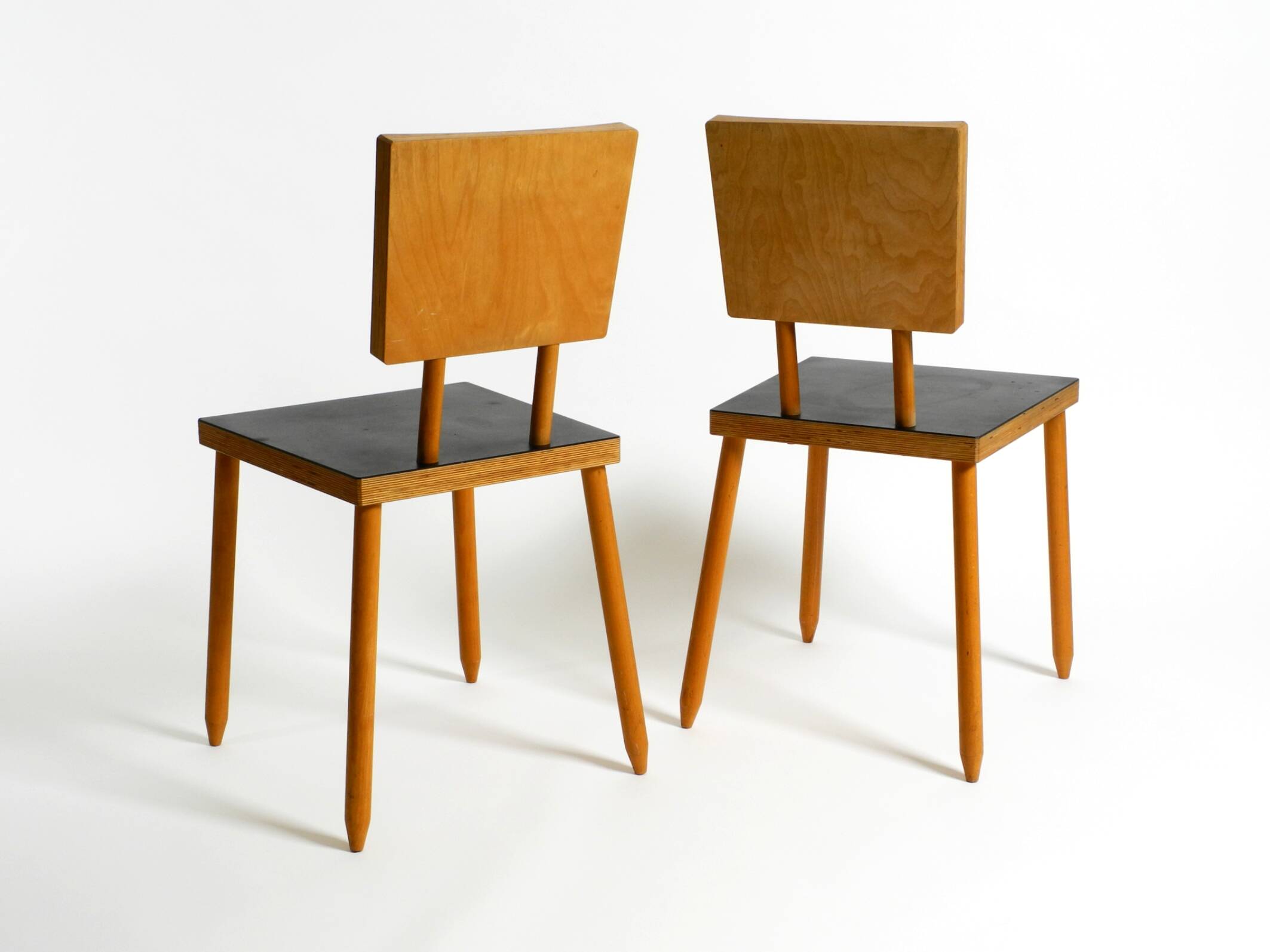 Two rare demountable plywood chairs by Axel Kufus model Stöcke for Atoll