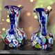 Pair of antique millefiori glass vases attributed to Murano with 2 handles.