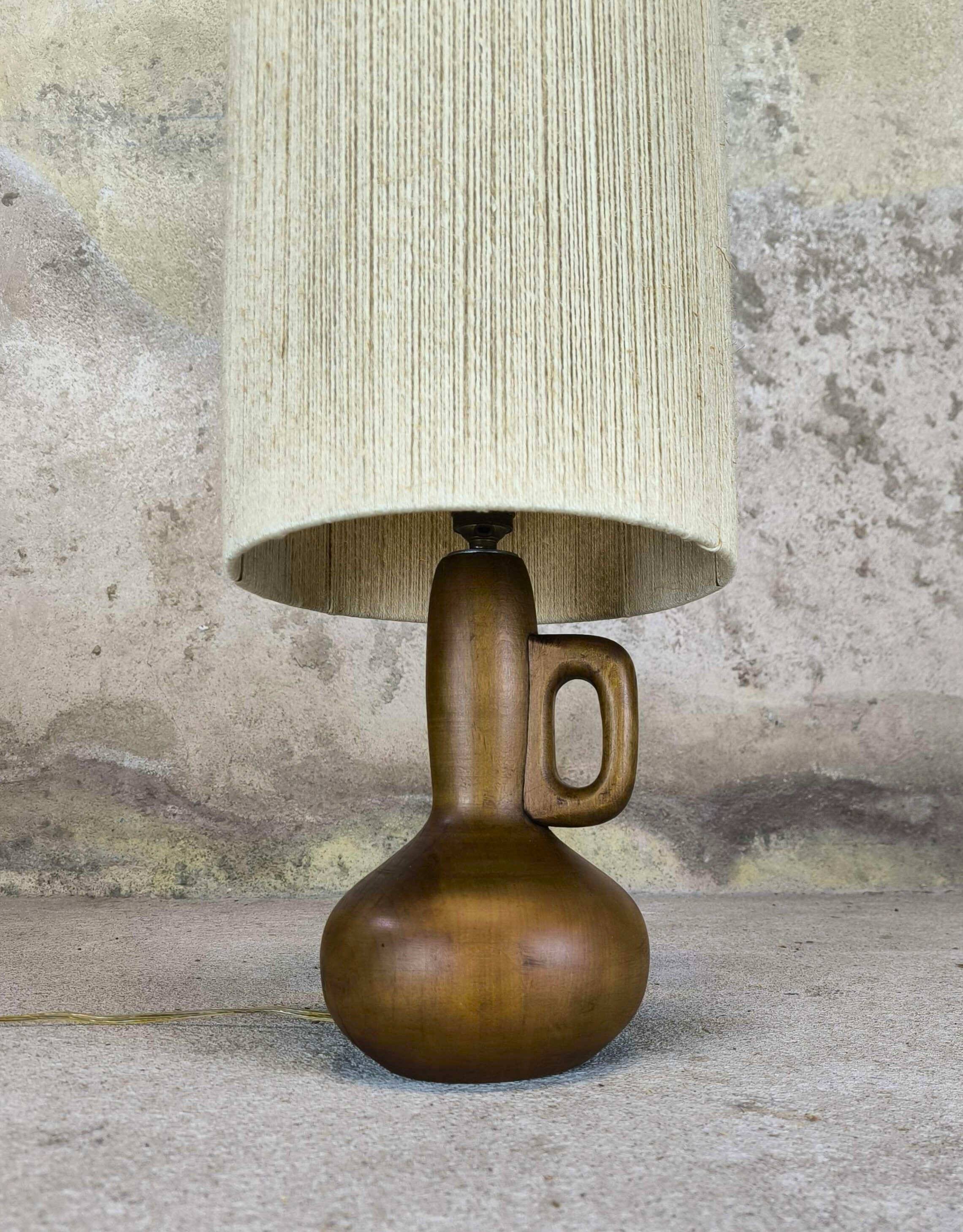 Vintage wooden table lamp with a wool shade.
