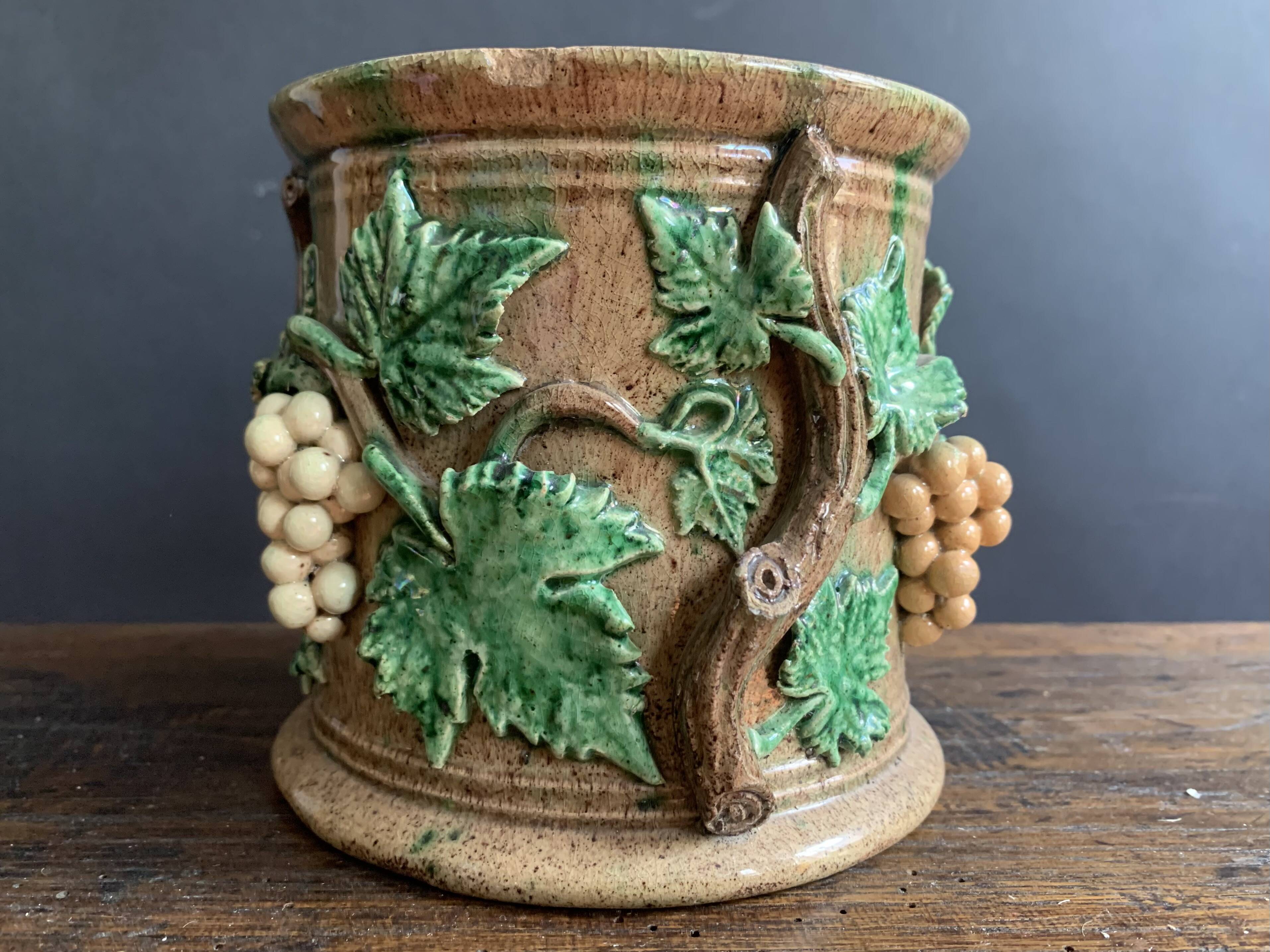 Large 19th century slip pot with vine decoration