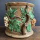 Large 19th century slip pot with vine decoration