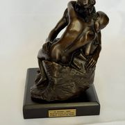 The bronze sculpture The Kiss, a reproduction of Rodin's statue, French sculpture.