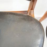 Set of four Arne Vodder chairs in hardwood and black leather.