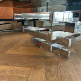 70s design coffee table in rectangular glass with chrome legs.