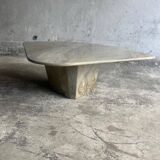 Light gray solid granite coffee table with organic triangular shape and conical base, 1980s