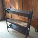 Magazine/book rack in oak with a caned top - early 20th century