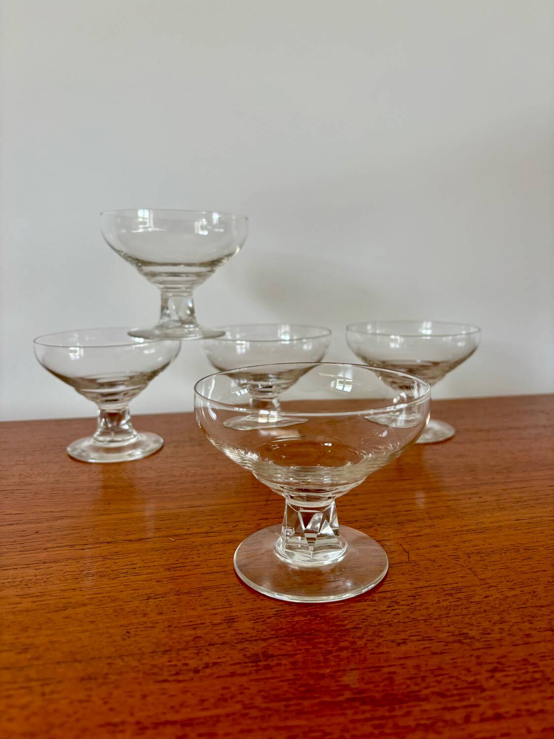 set of 5 crystal champagne glasses, worked and faceted feet, 1960