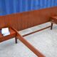 Teak bed with hanging bedside tables from the 60s