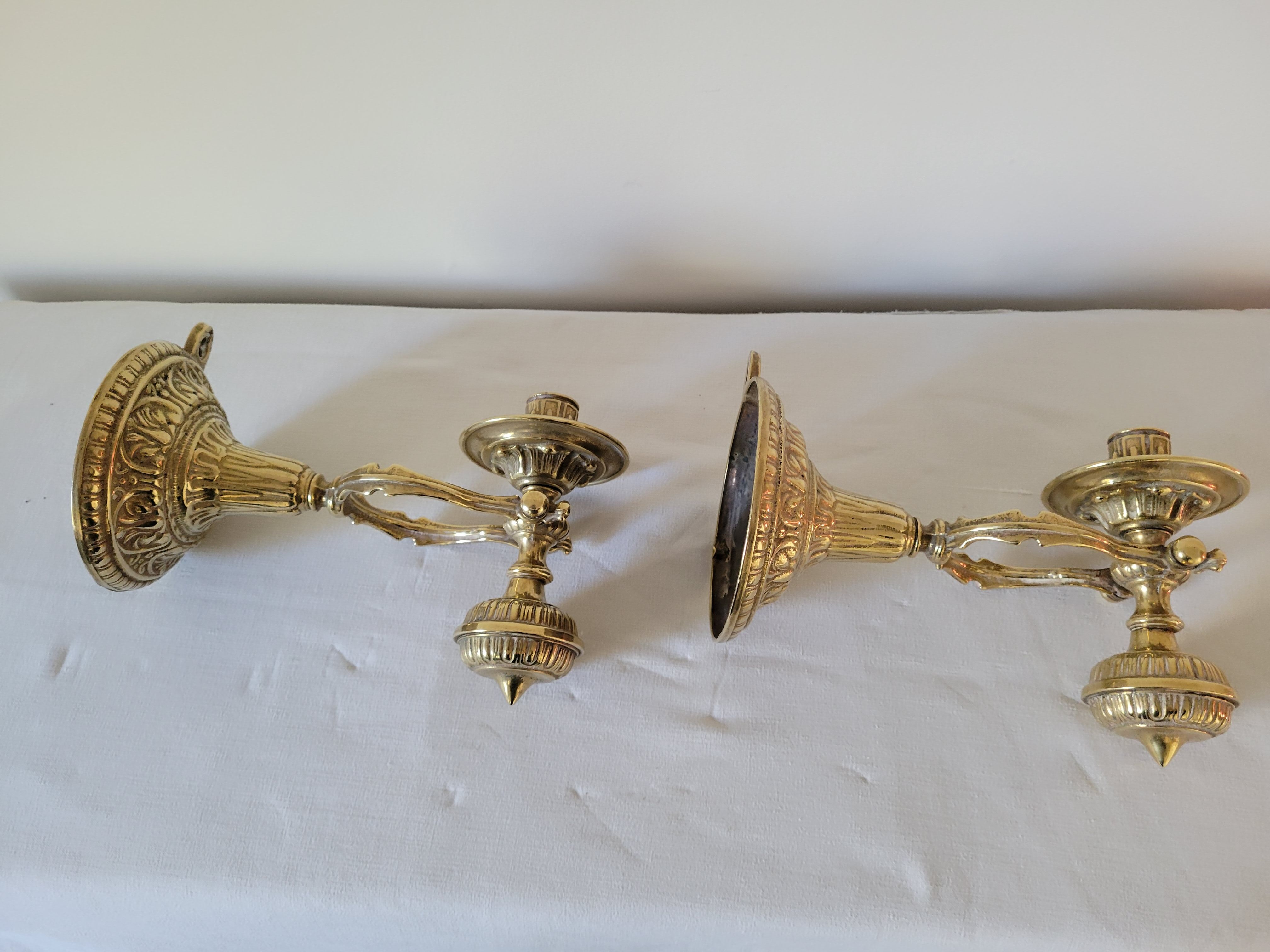 Duo of brass balance wall candle holders