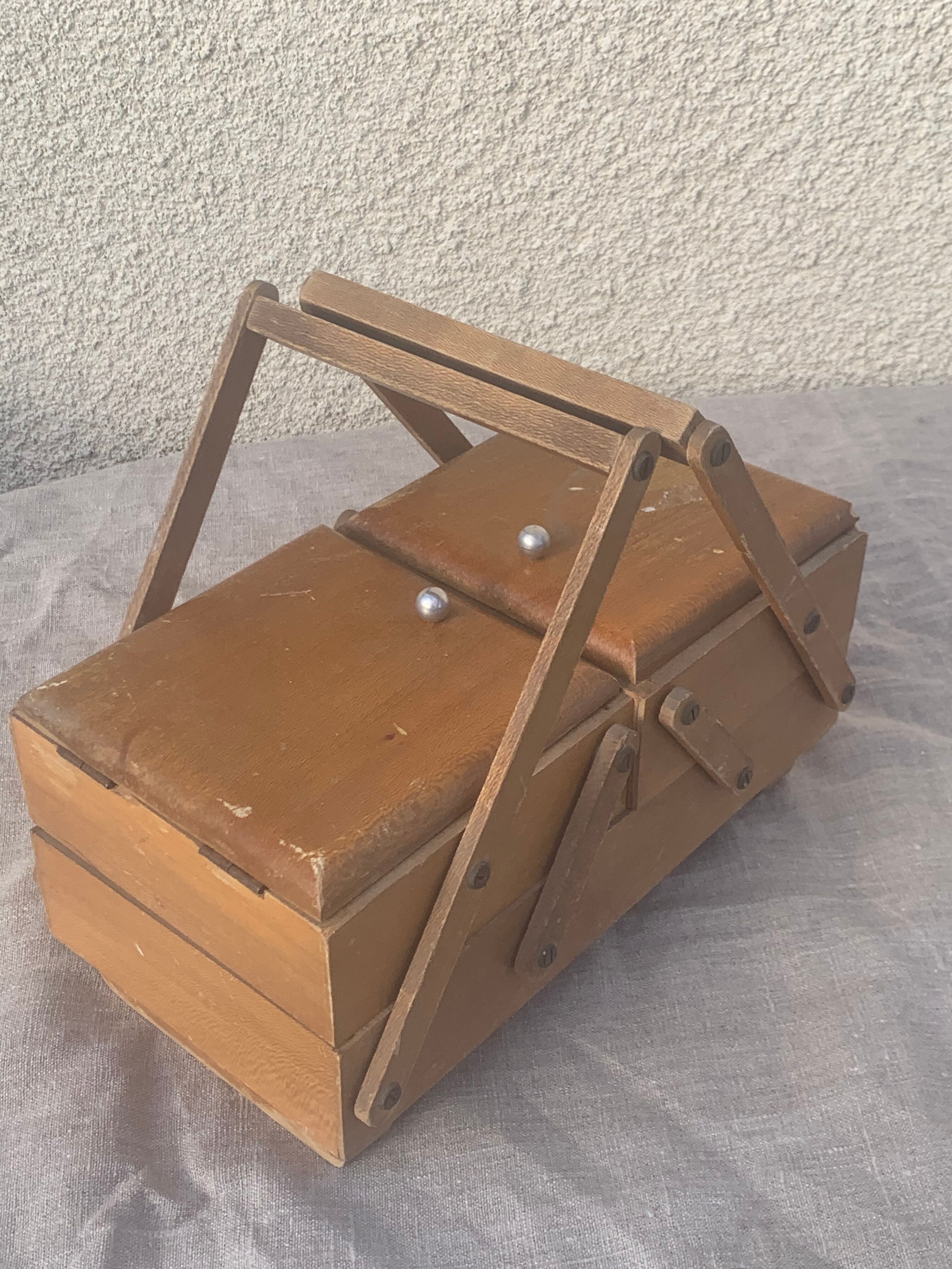 Sewing box in old varnished wood