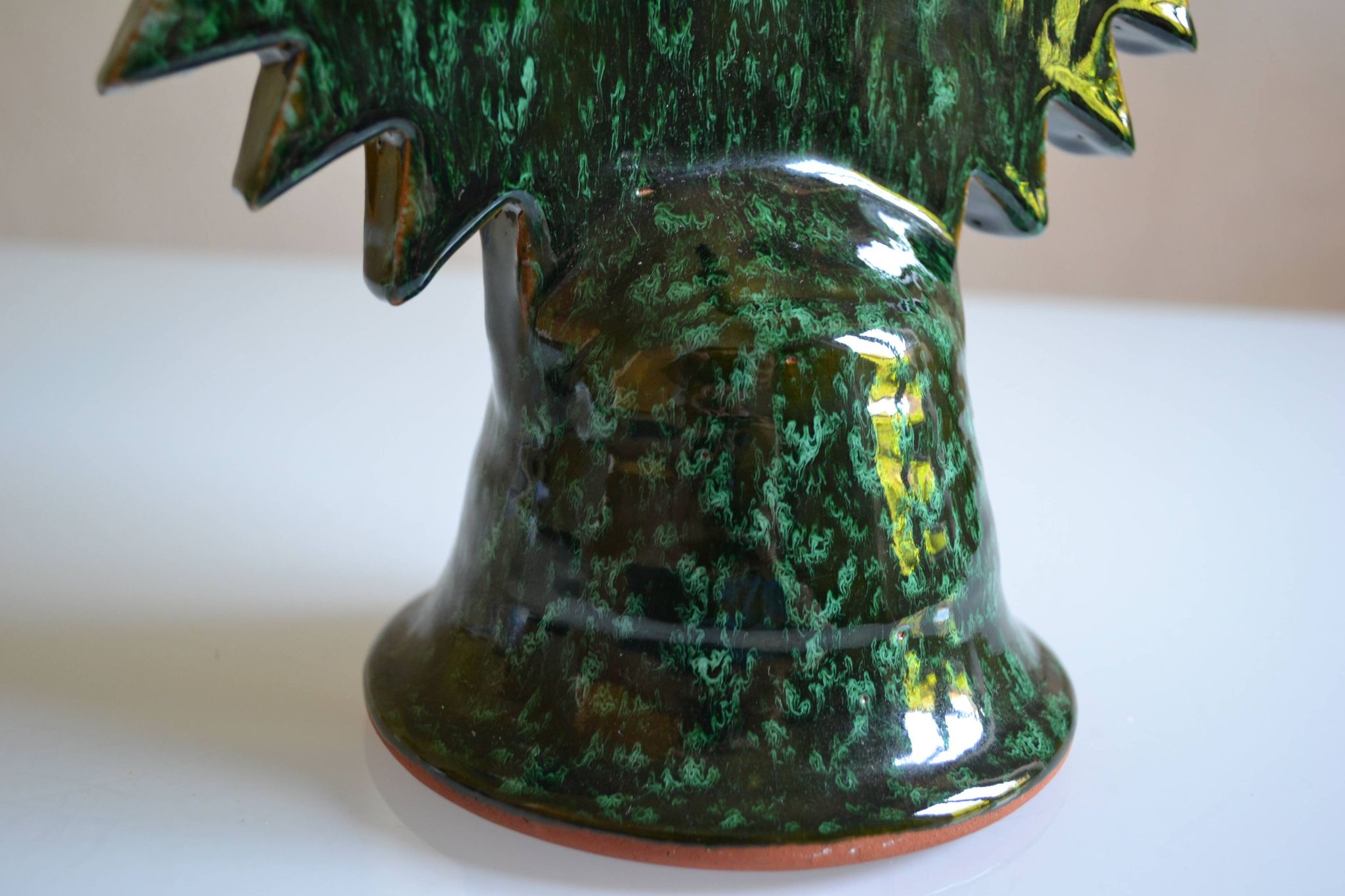 Green ceramic sun candlestick from Tamegroute, Morocco.