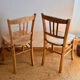Set of 2 vintage bistro chairs in raw wood.