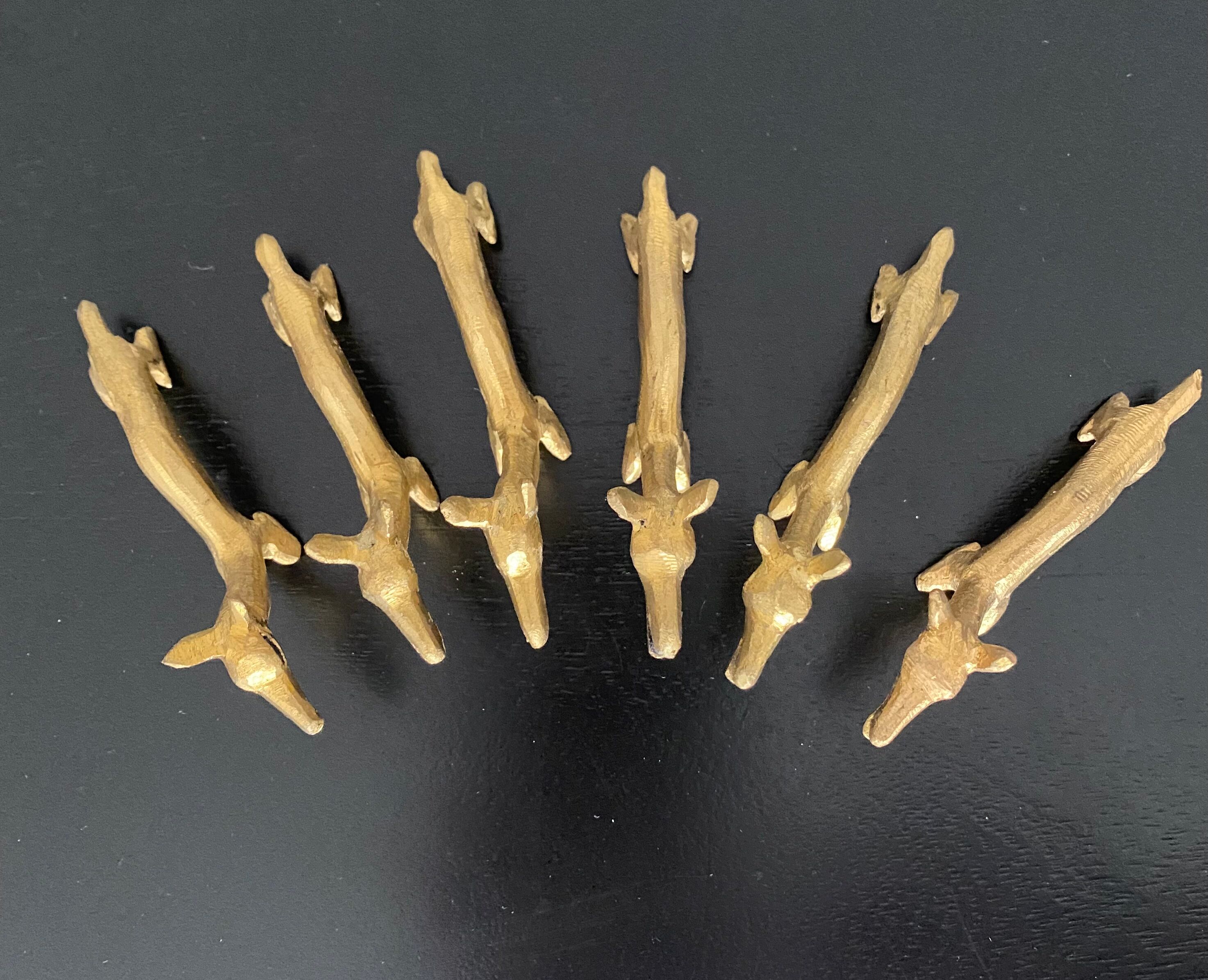 6 brass dromedary-shaped knife holders