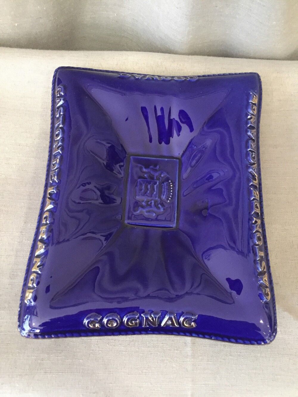 FRIENDLY ASHTRAY PICKS UP MONEY OR EMPTY POCKET COGNAC GASTON DE LAGRANGE BLUE AND DORE