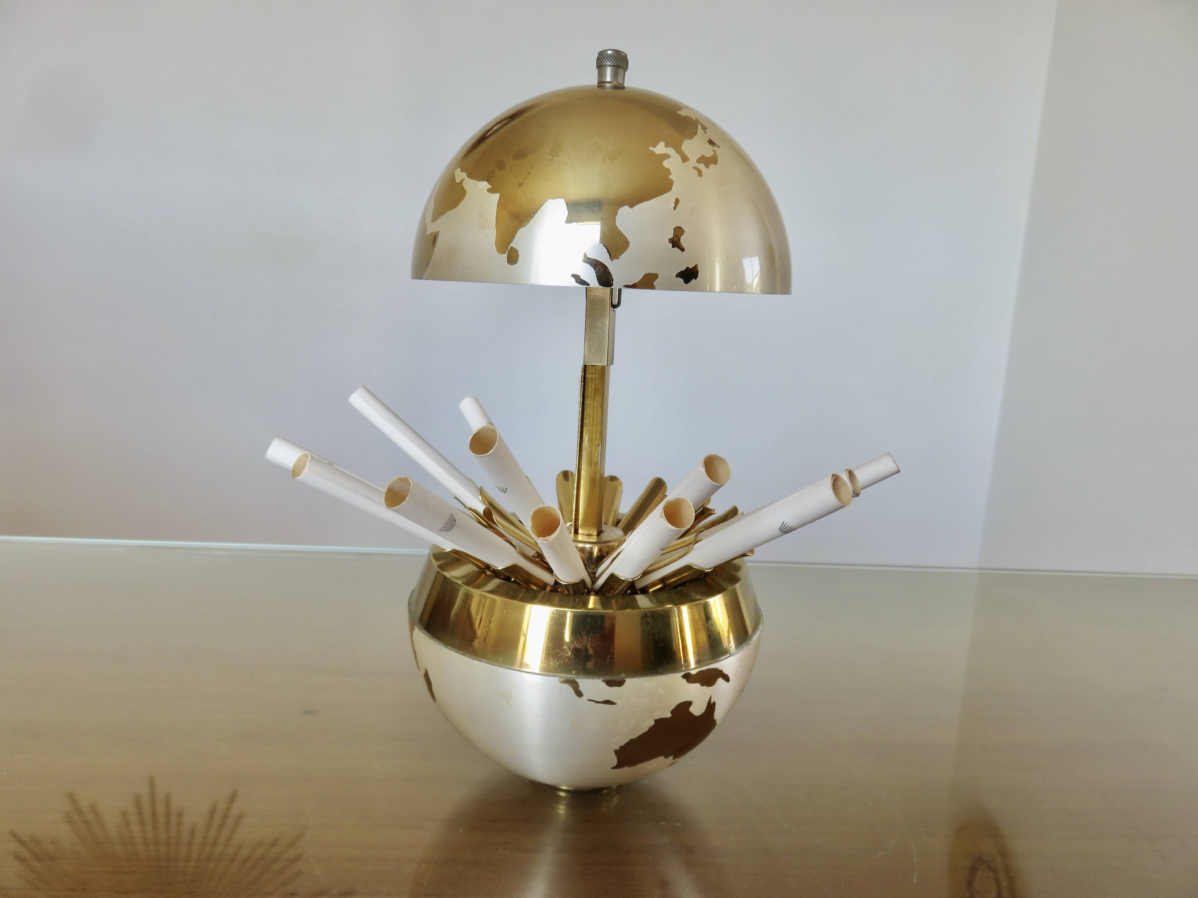 Large terrestrial globe, cigarette dispenser, brass, 1960 - 1970