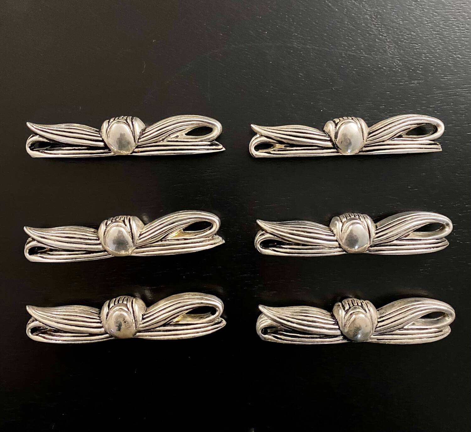 6 metal bow-shaped knife holders