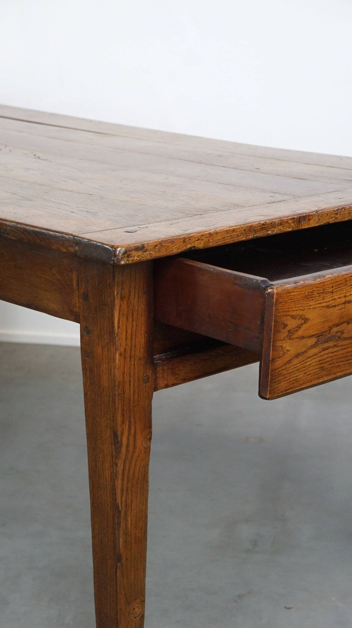 antique French oak dining table with 3 drawers and an exquisite patina