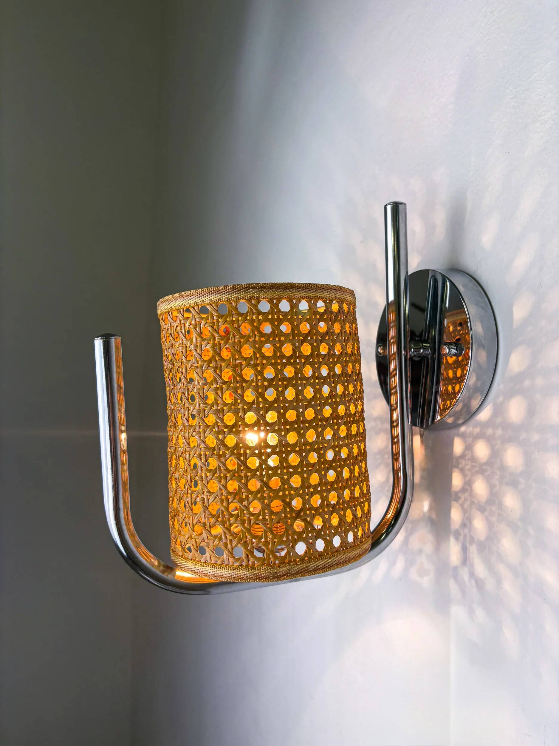 Pair of vintage rattan & chrome wall lights, Italy, 1970s
