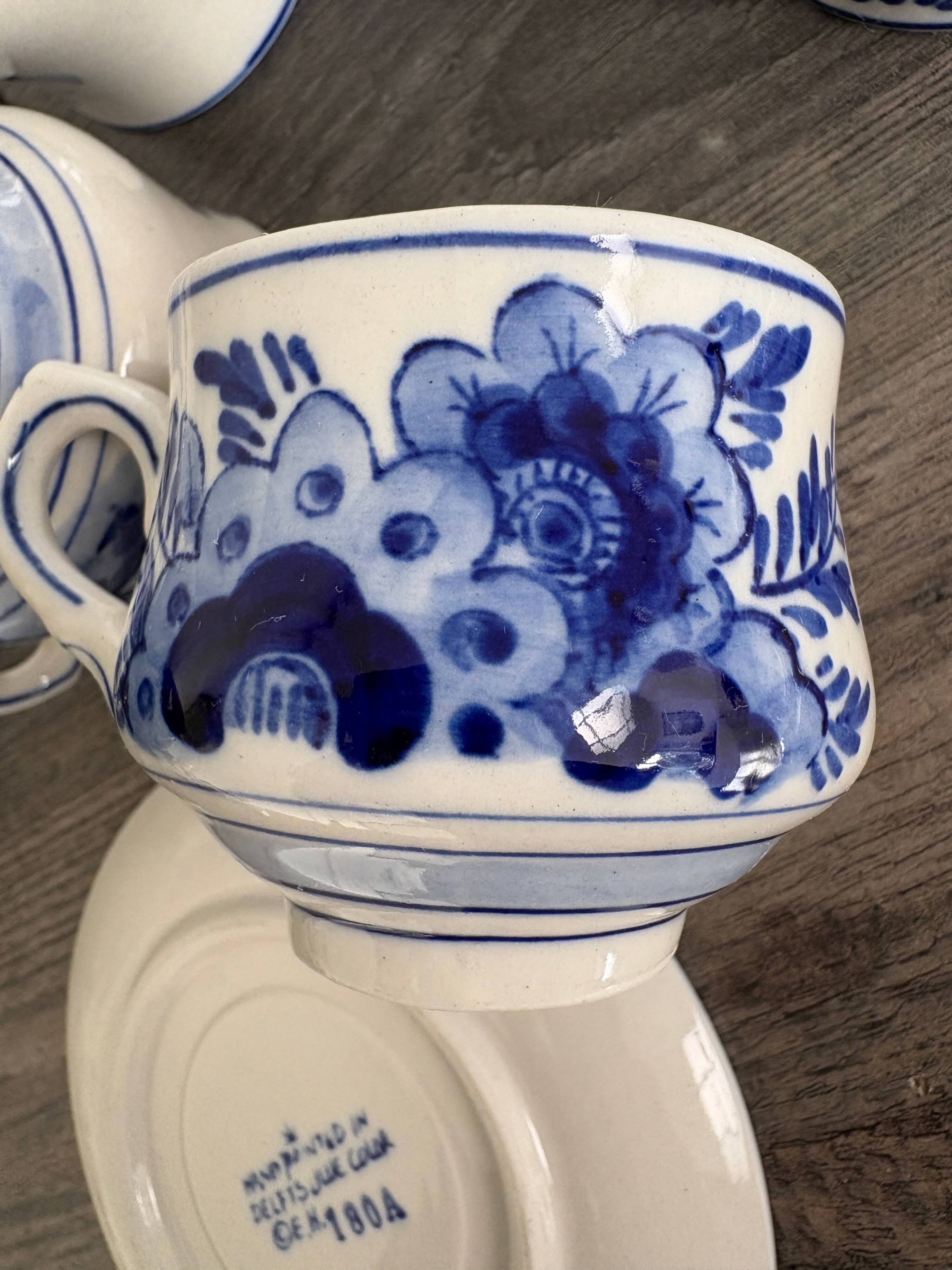 Vintage Dutch Delft Blue earthenware service for 5 cups and saucers.