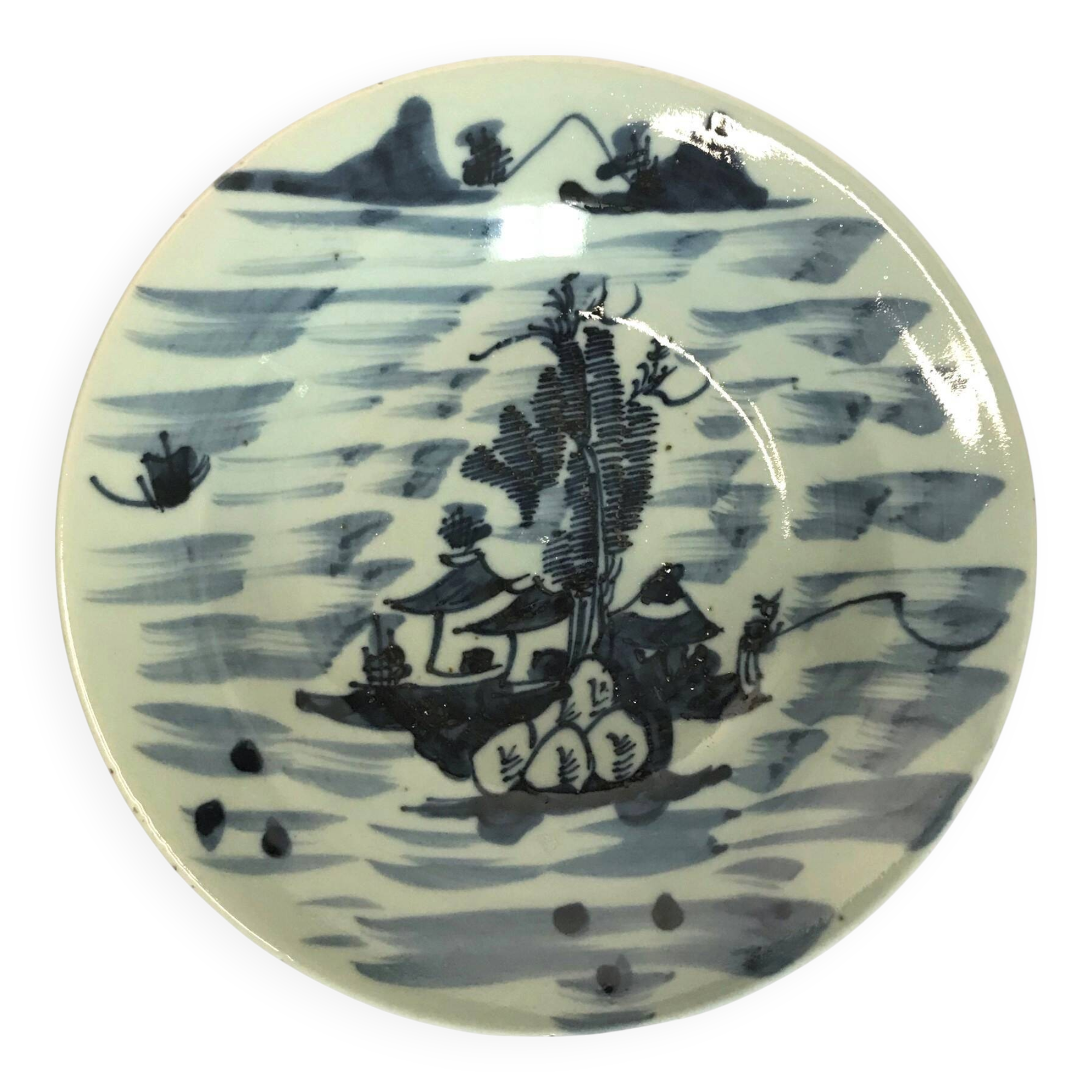 Asia, celadon porcelain plate with fisherman decor, late 19th century