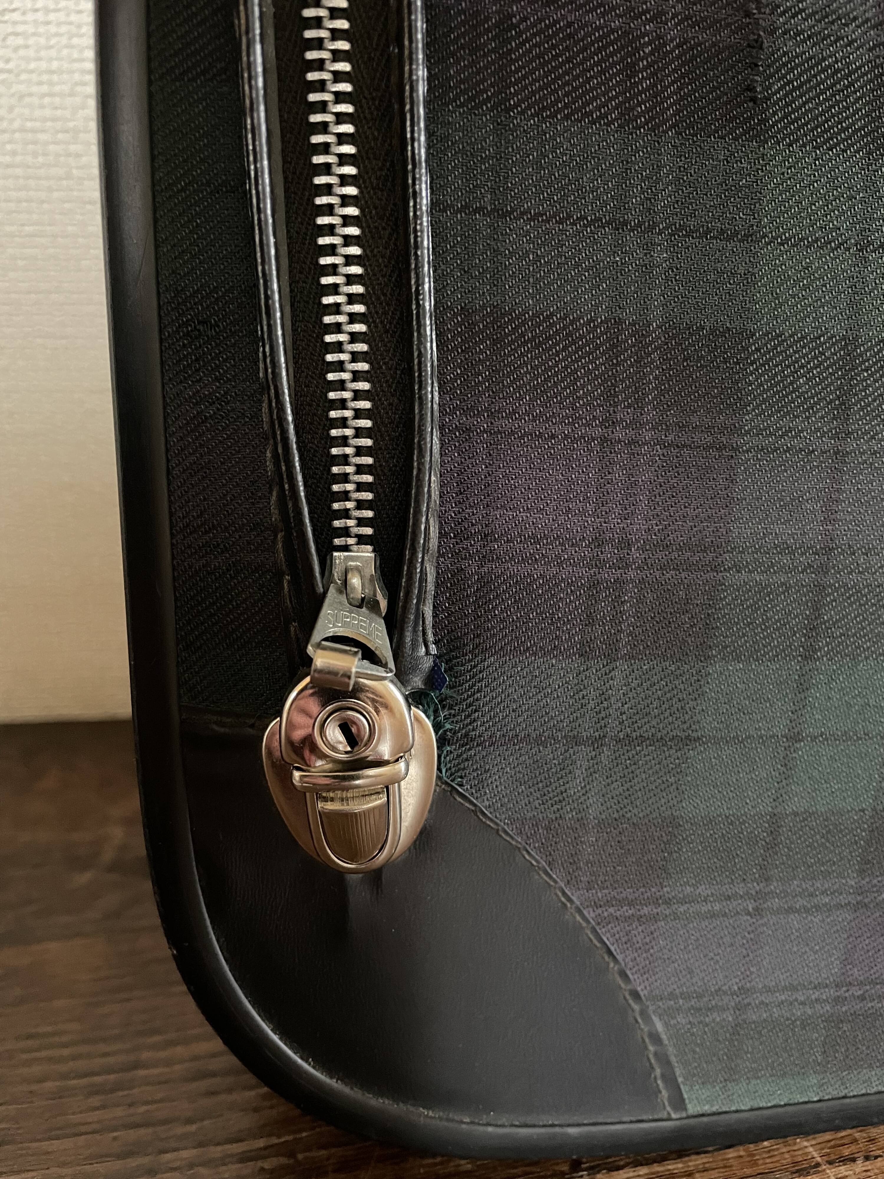 Tartan check suitcase