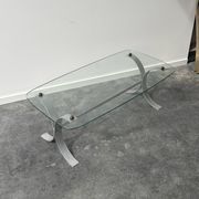 Design coffee table in brushed metal with a glass top, 1970s.