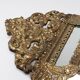 Antique French mirror in repoussé brass with a 19th-century pediment (60*34 cm)