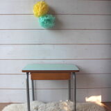 Green formica desk of water