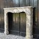 Louis XV fireplace in grey Ardennes marble, a floral basket in white marble, late 18th century.