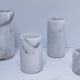 Four white marble candlesticks with black veins, 70s design