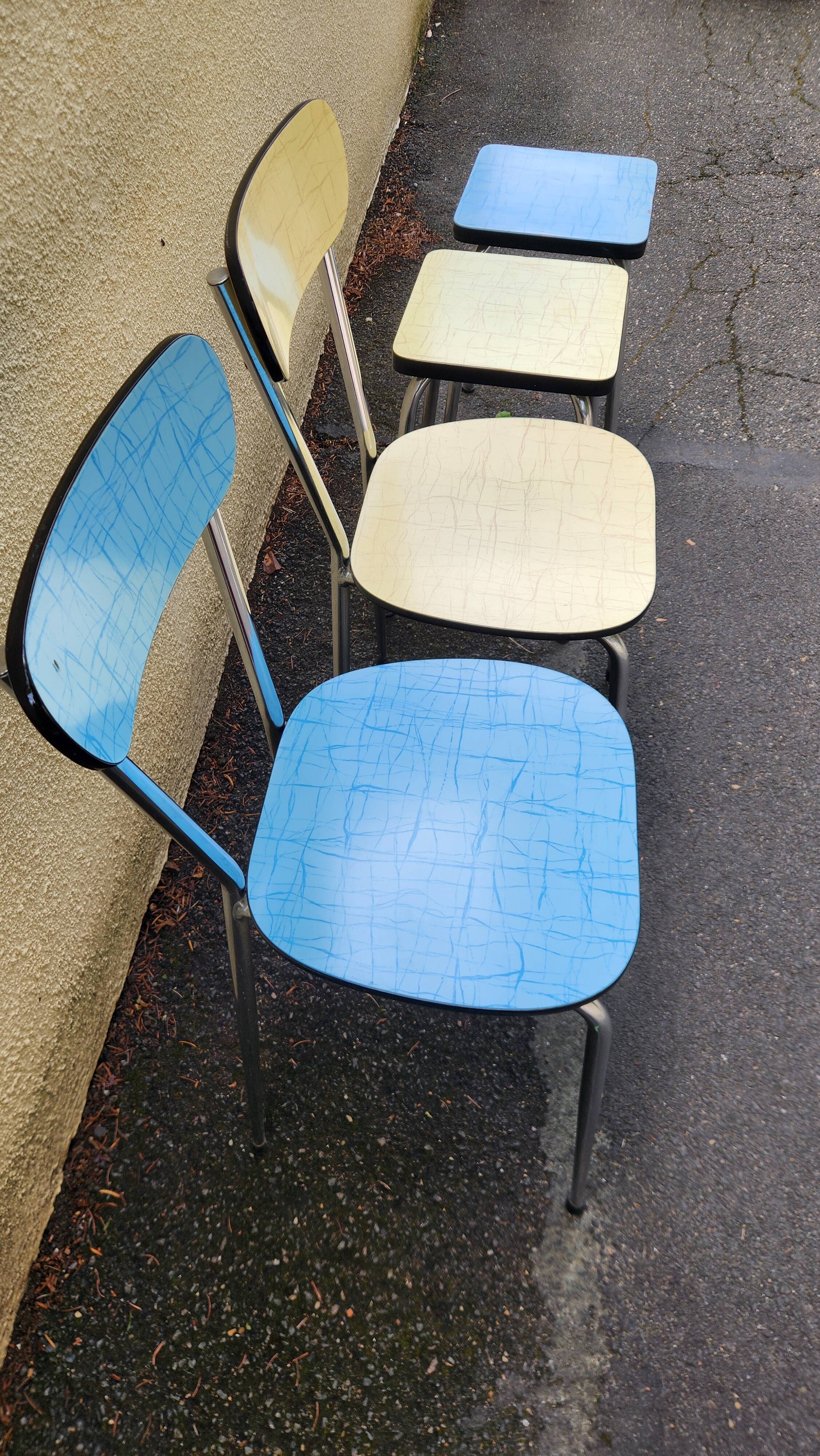 Vintage set from the 60s/70s: table, chairs, and marbled Formica stools.